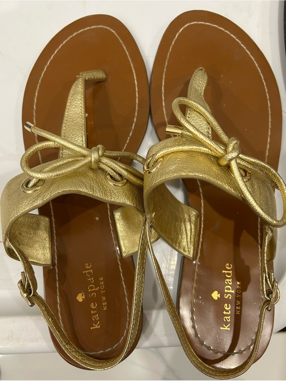 kate spade Metallic Gold Leather Bow Thong Sandals